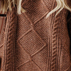 Close-up of a brown textured fabric with intricate patterns - Fasllot
