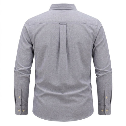 A men's long-sleeve button-down shirt shown from the back, featuring a heather gray fabric, a vertical pleat down the center back, and gold-tone button details on the cuffs. - Fashlot 