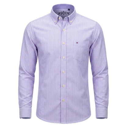 A men's long-sleeve button-down shirt with light purple and white vertical stripes, featuring a classic collar, button-up front, and a small embroidered chest logo on a light gray background. - Fashlot 