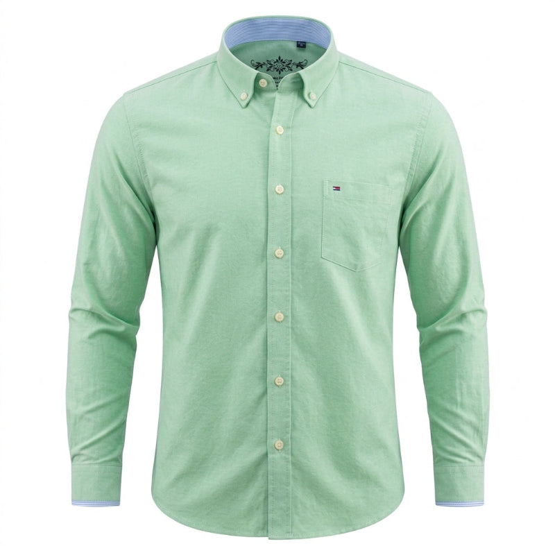 A light green long-sleeve button-down shirt with a chest pocket and a small Tommy Hilfiger flag logo on the left chest, shown on a plain white background. - Fashlot