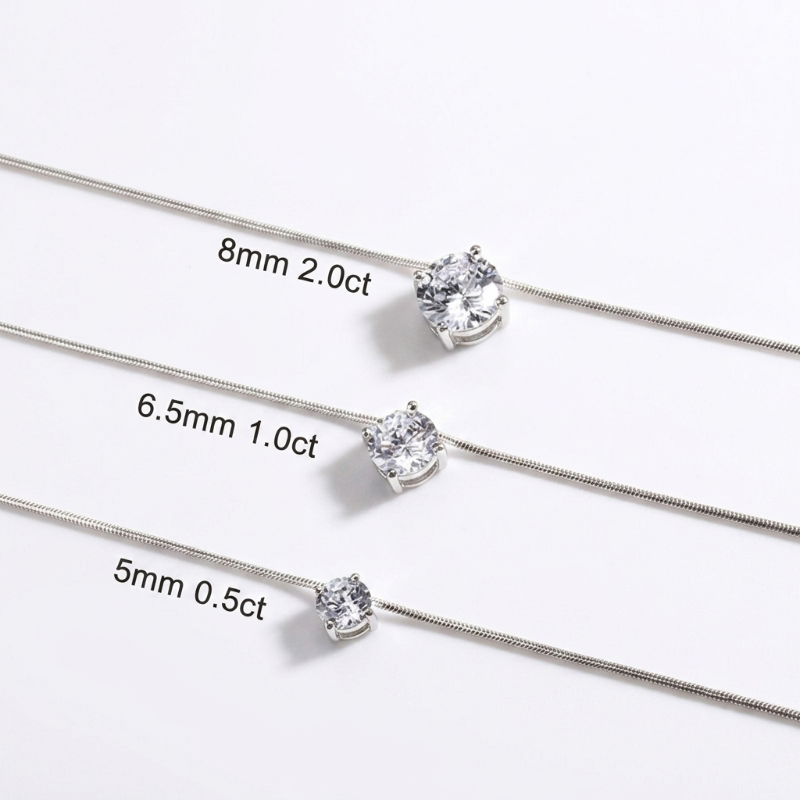Three silver-toned chain necklaces with single clear gemstones are shown on a white background, each labeled with size and carat information: 8mm 2.0ct, 6. - Fashlot