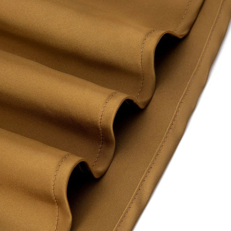 Close-up of gold fabric with a white background - Fashlot