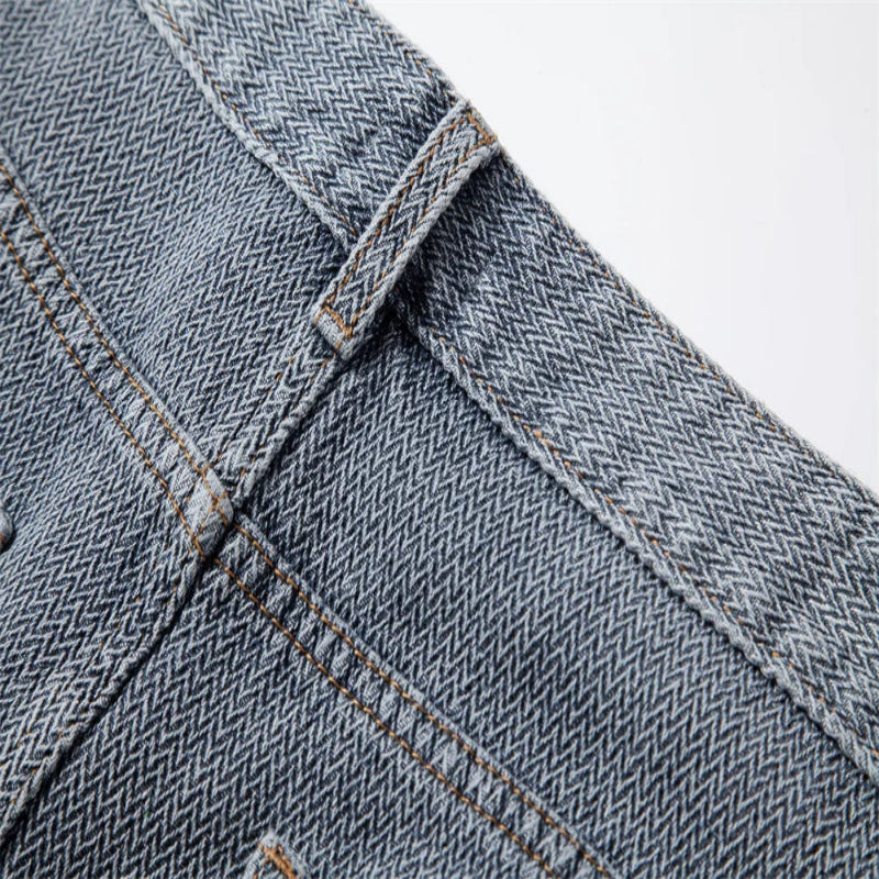 Close-up of back of blue denim fabric with stitching details - Fashlot