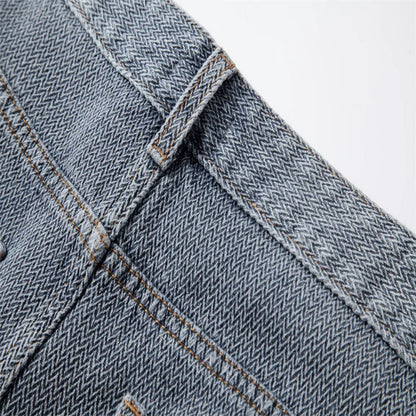 Close-up of back of blue denim fabric with stitching details - Fashlot