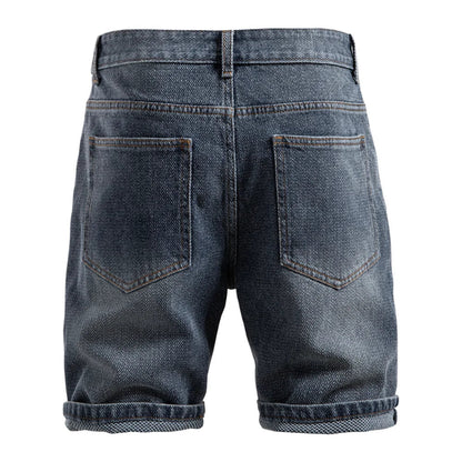 Back view of blue denim shorts on a white background