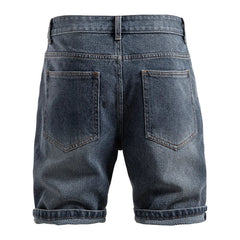 Back view of blue denim shorts on a white background