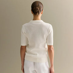 Back view person wearing a off white knit shirt against a beige background - Fashlot