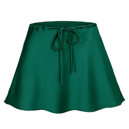 Green satin skirt with a tie waist on a white background