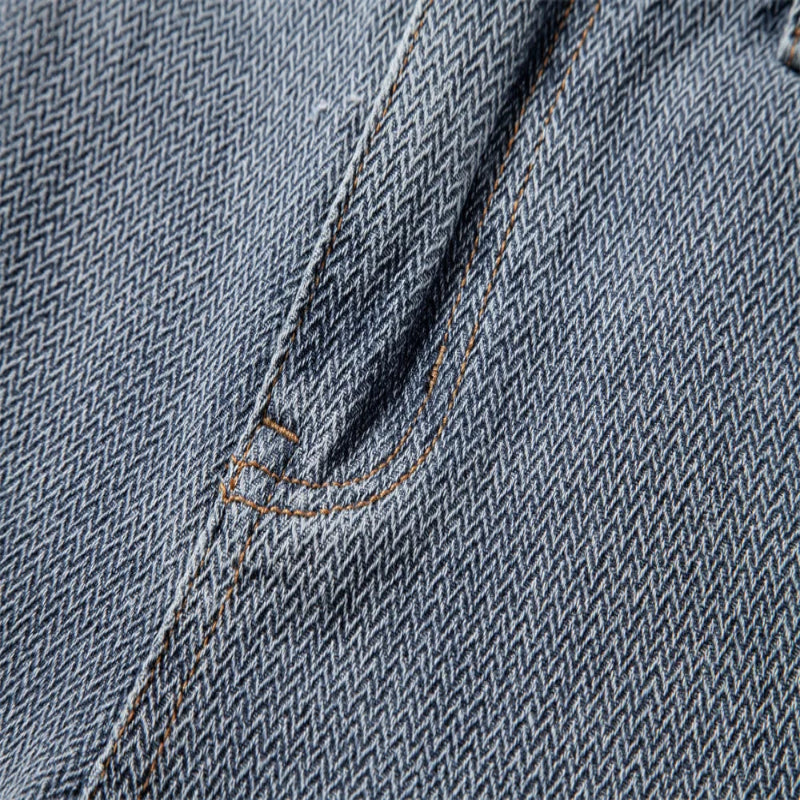 Close-up of denim fabric with a pocket detail - Fashlot