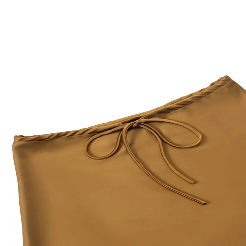 gold satin skirt with a bow on a white background - Fashlot