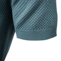 Close-up of a textured blue sweater sleeve on a white background - Fashlot