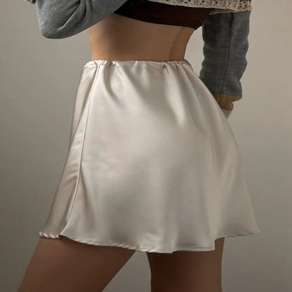 Beige satin slip skirt worn by a person against a neutral background - Fashlot
