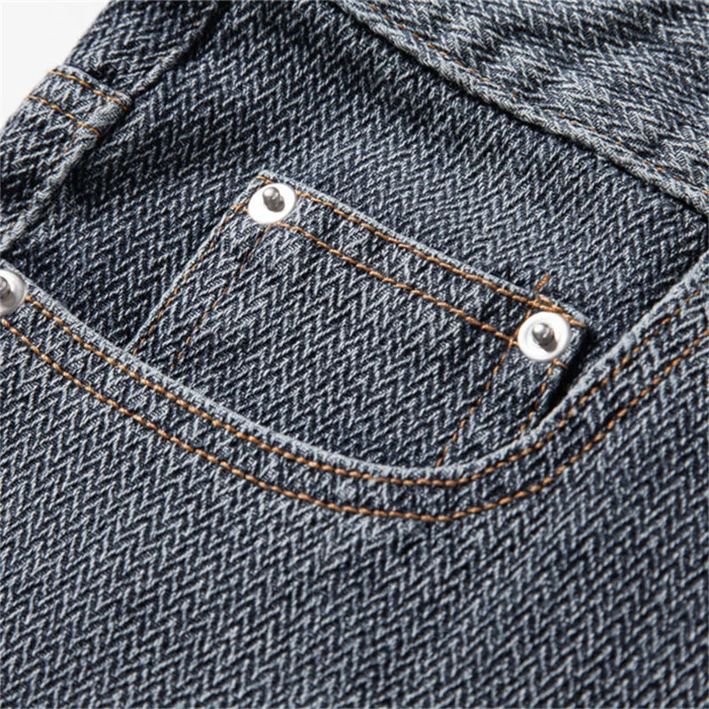 Close-up of a pocket on a pair of blue jeans with stitching details. - Fashlot