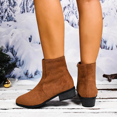 Brown ankle boots worn with a snowy landscape background - Fashlot